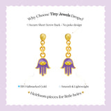 Tiny Jewels gold and purple hamsa hand earrings on a white background with text about Tiny Jewels.