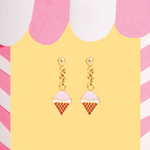 Tiny Jewels ice cream cone earrings on a colorful background