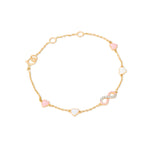 Tiny Jewels gold bracelet with heart-shaped pink and white beads on a white background