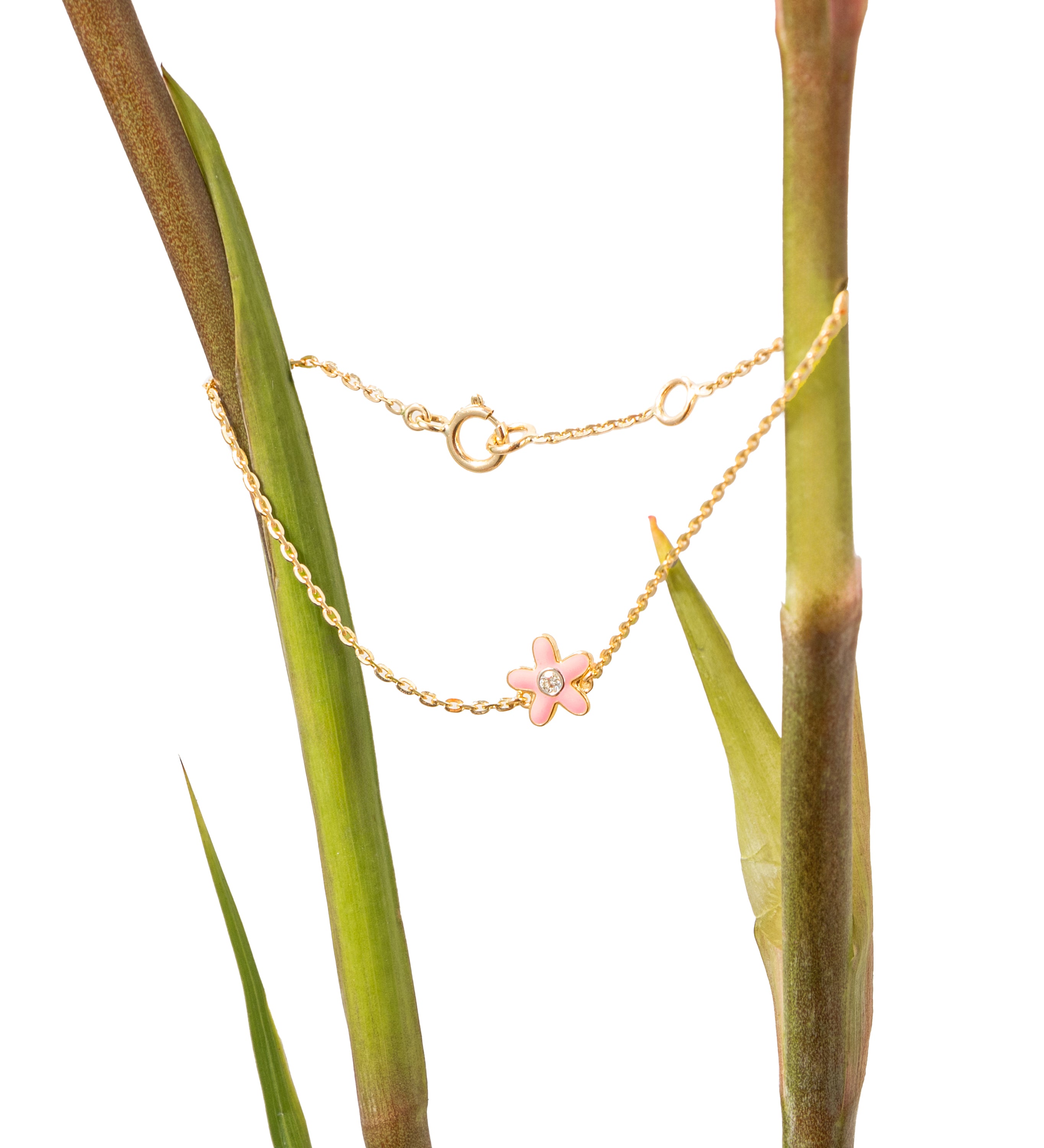 Tiny Jewels gold necklace with a pink flower pendant on a plant stem