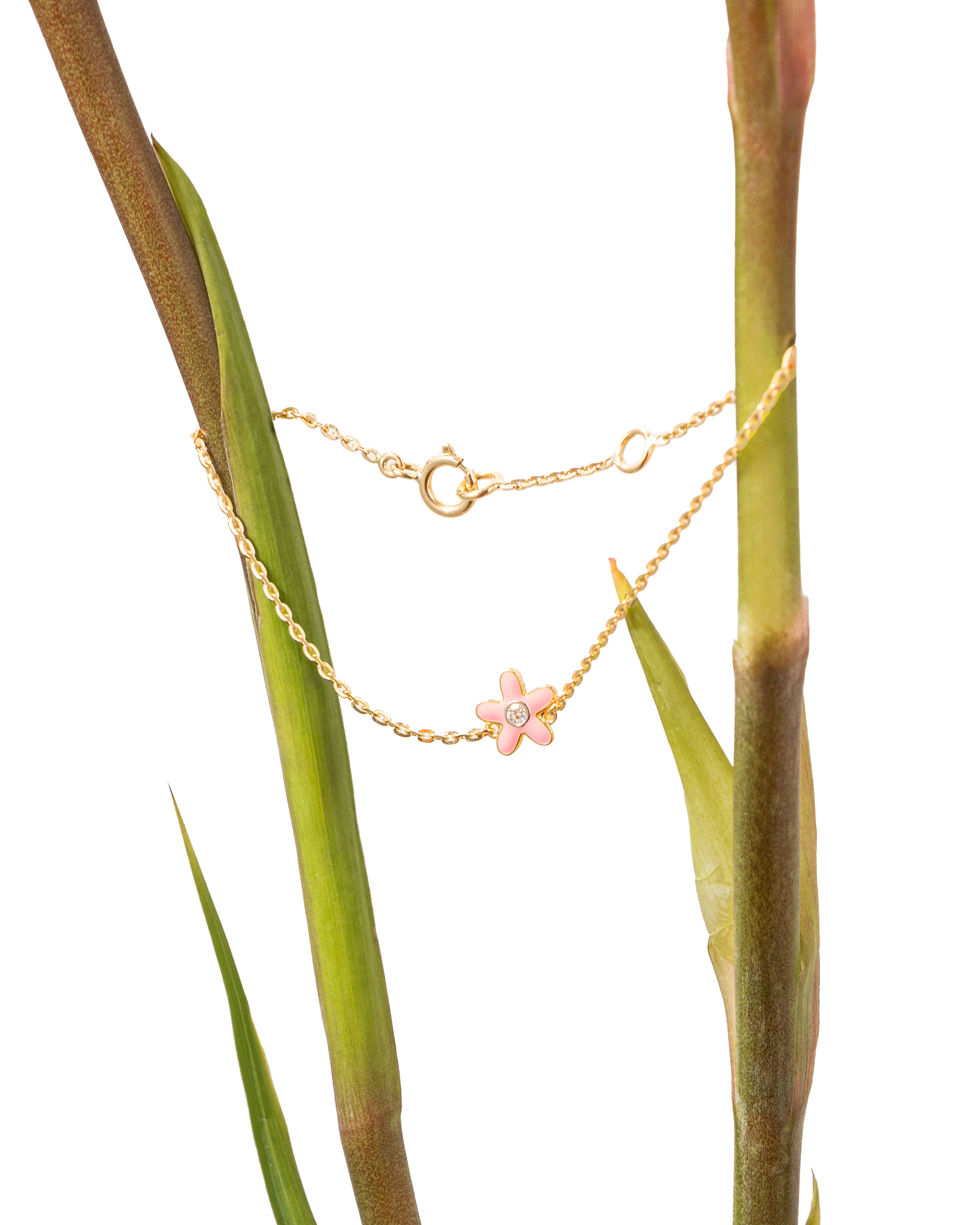 Tiny Jewels gold necklace with a pink flower pendant on a plant stem