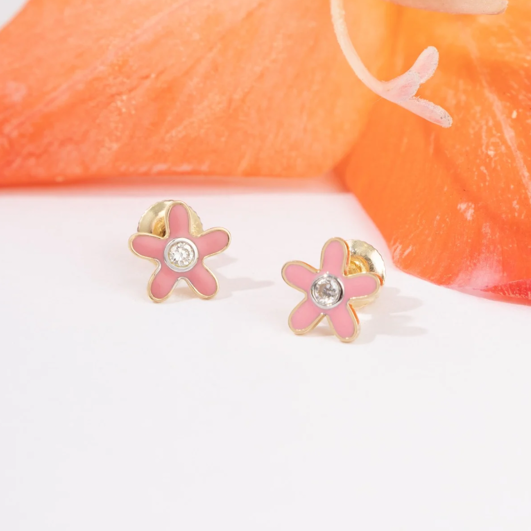 Tiny Jewels pink flower-shaped earrings with gold accents on a white background