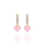 Tiny Jewels gold hoop earrings with heart-shaped charms on a white background