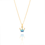 Tiny Jewels gold crown pendant with blue and gold accents on a white background