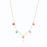 Tiny Jewels necklace with colorful flower-shaped pendants on a white background
