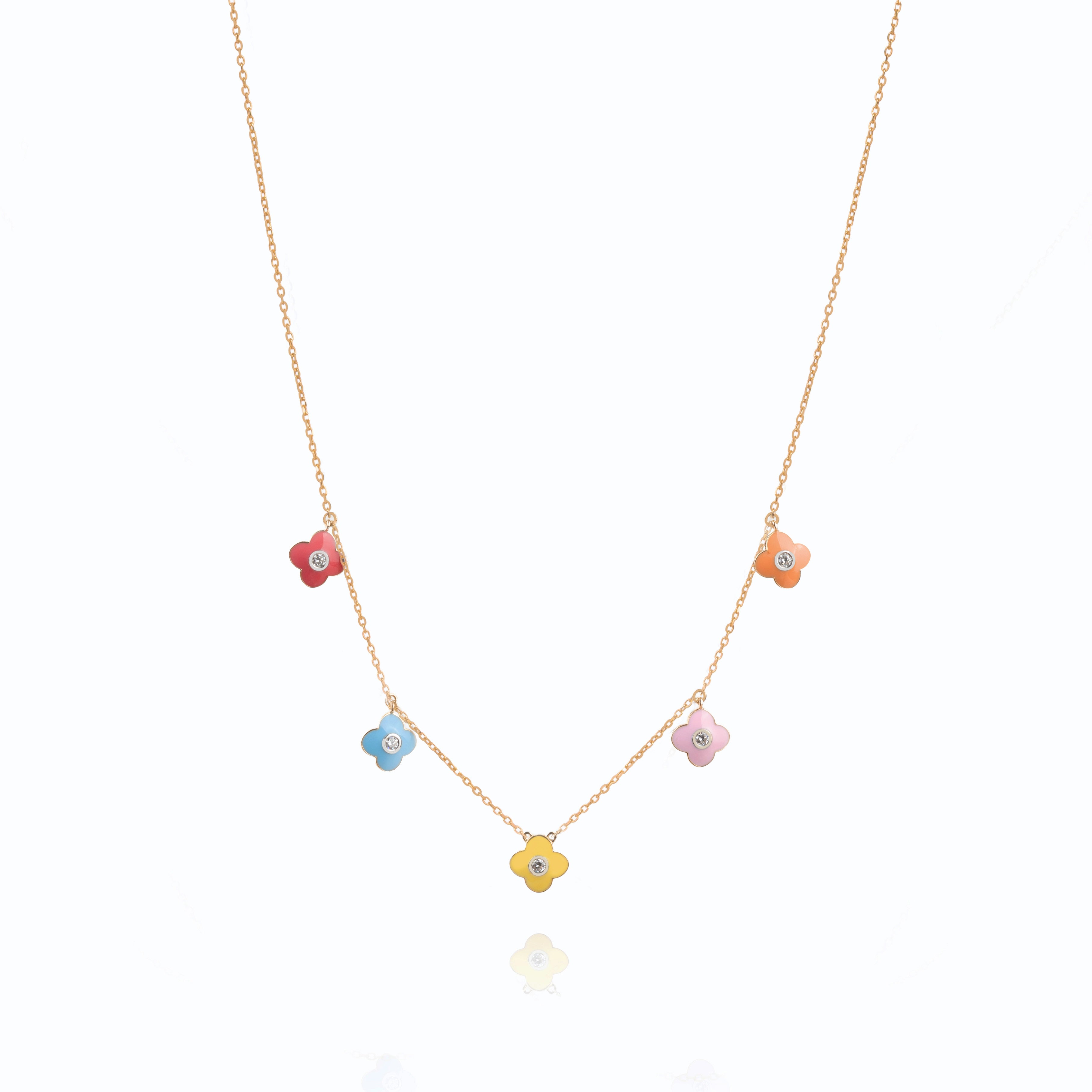 Tiny Jewels necklace with colorful flower-shaped pendants on a white background