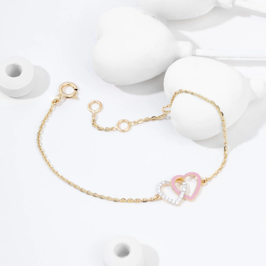 Tiny Jewels gold bracelet with a heart-shaped charm on a white background
