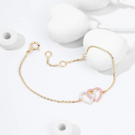 Tiny Jewels gold bracelet with a heart-shaped charm on a white background