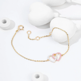 Tiny Jewels gold bracelet with a heart-shaped charm on a white background