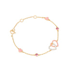 Tiny Jewels gold bracelet with pink heart-shaped charms on a white background