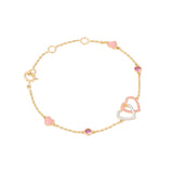 Tiny Jewels gold bracelet with pink heart-shaped charms on a white background