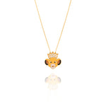 Gold necklace with a lion head pendant on a white background