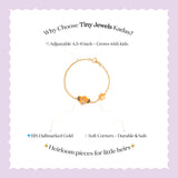 Tiny Jewels gold bracelet with a fox charm on a white background with text about Tiny Jewels Kadas.