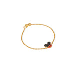 Tiny Jewels gold bracelet with a black and red heart charm on a white background