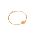 Tiny Jewels gold bracelet with a pink flower charm on a white background
