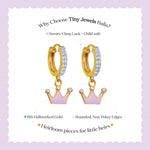Tiny Jewels gold hoop earrings with pink crowns on a white background with text about Tiny Jewels Balis.
