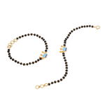 Tiny Jewels black beaded necklace with gold clasp on a white background