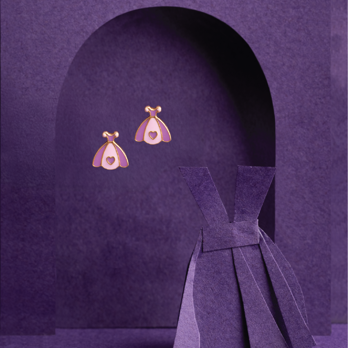 Tiny Jewels purple dress with a bow and matching earrings on a purple background