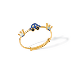 Tiny Jewels gold bracelet with blue car charm on a white background