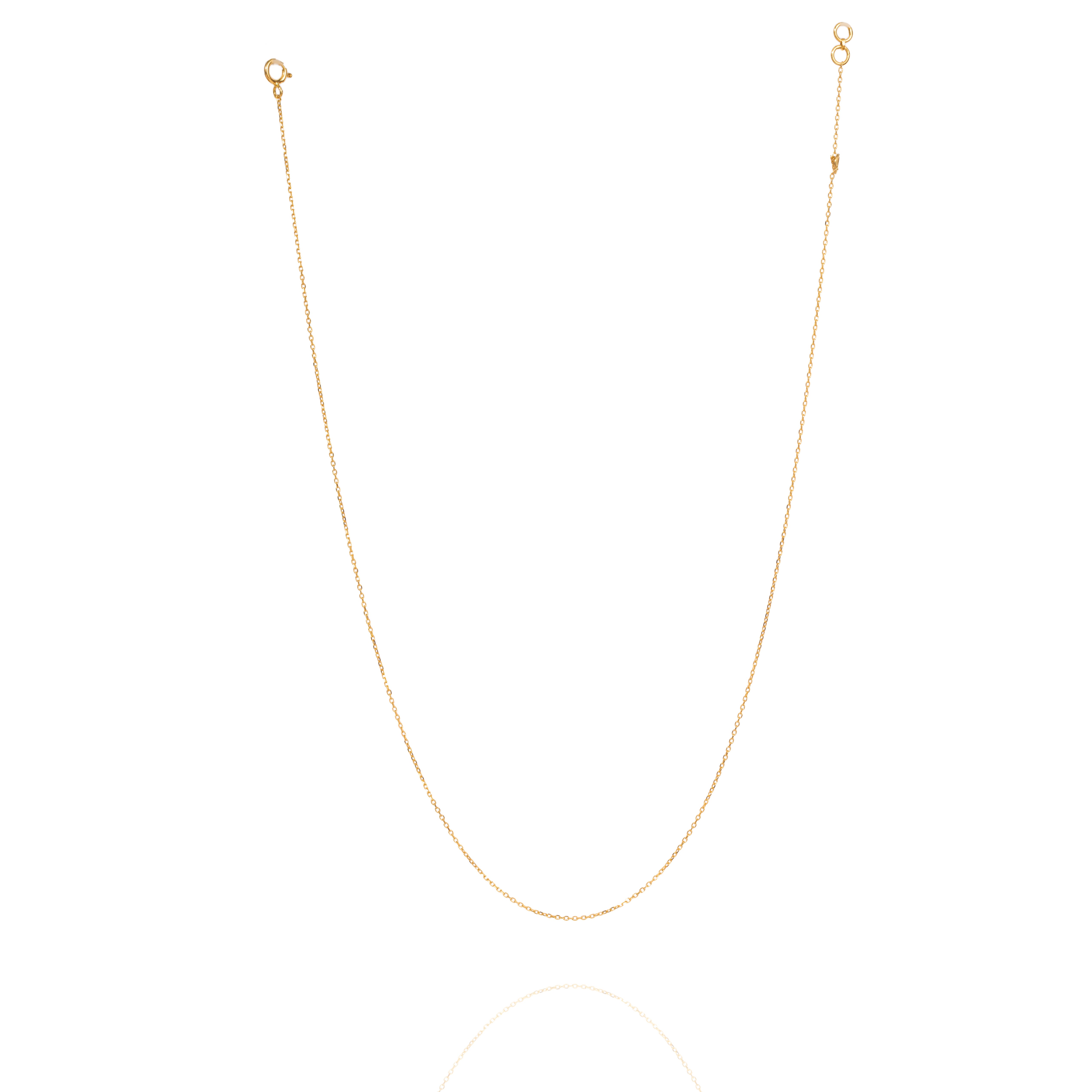 Tiny Jewels gold chain necklace on a white background