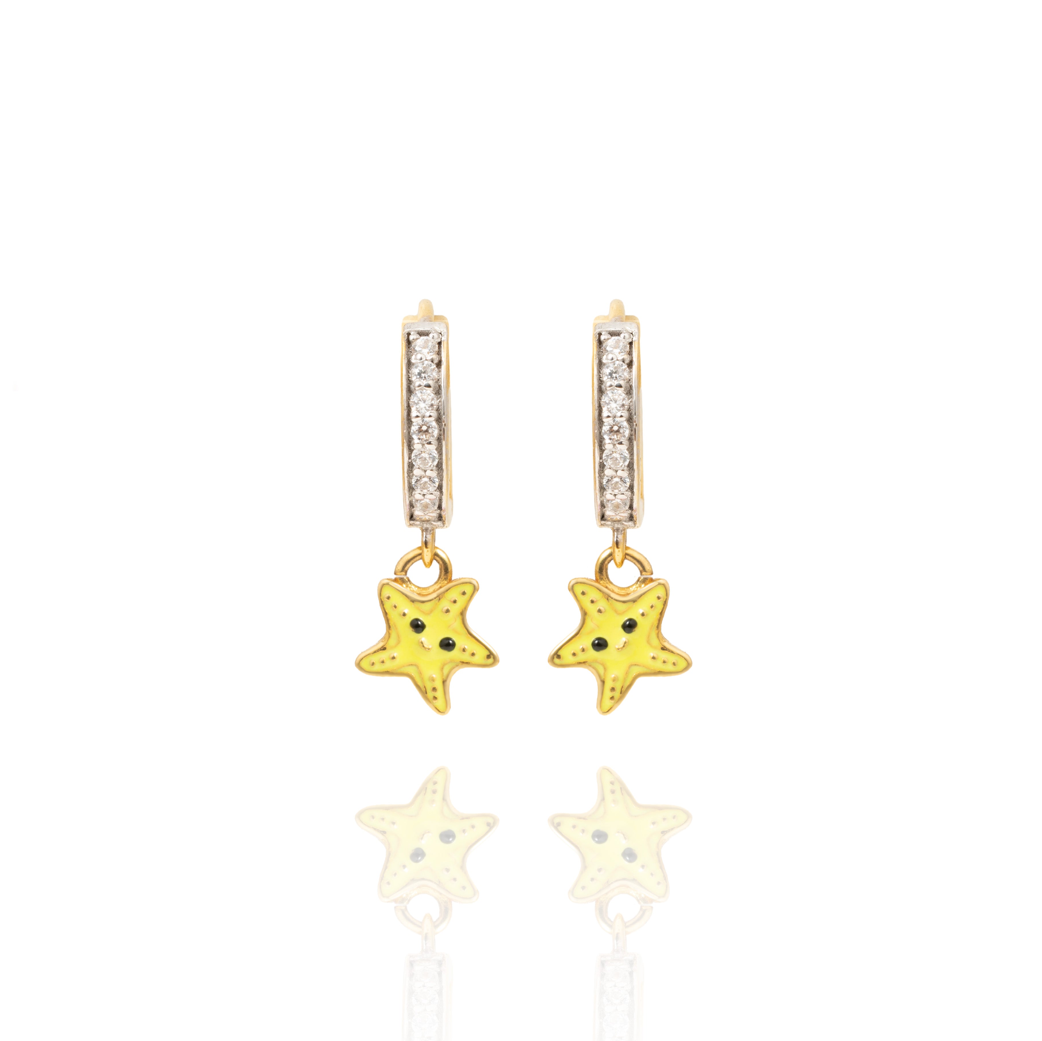 Tiny Jewels star-shaped earrings with gold and yellow colors on a white background