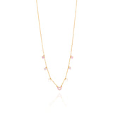 Tiny Jewels gold necklace with heart-shaped pendants on a white background