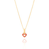 Tiny Jewels Gold pendant with a red heart-shaped design on a white background