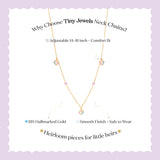 Tiny Jewels gold necklace with small colored stones on a light purple background with text about the necklace's features.