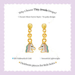 Tiny Jewels gold unicorn-shaped earrings on a white card with text about Tiny Jewels.