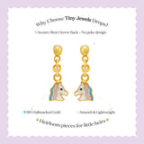 Tiny Jewels gold unicorn-shaped earrings on a white card with text about Tiny Jewels.