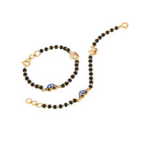 Tiny Jewels black beaded necklace with gold accents on a white background