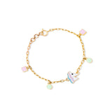 Tiny Jewels gold bracelet with colorful charms on a white background