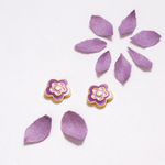 Tiny Jewels pair of purple flower-shaped earrings on a white background